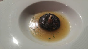 A dish from Biko (CMDX) featuring broth and a mushroom