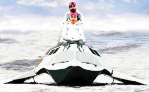 Anuj and Praba on top of a white aircraft. They each wear white body sutis and colorful head adornments.